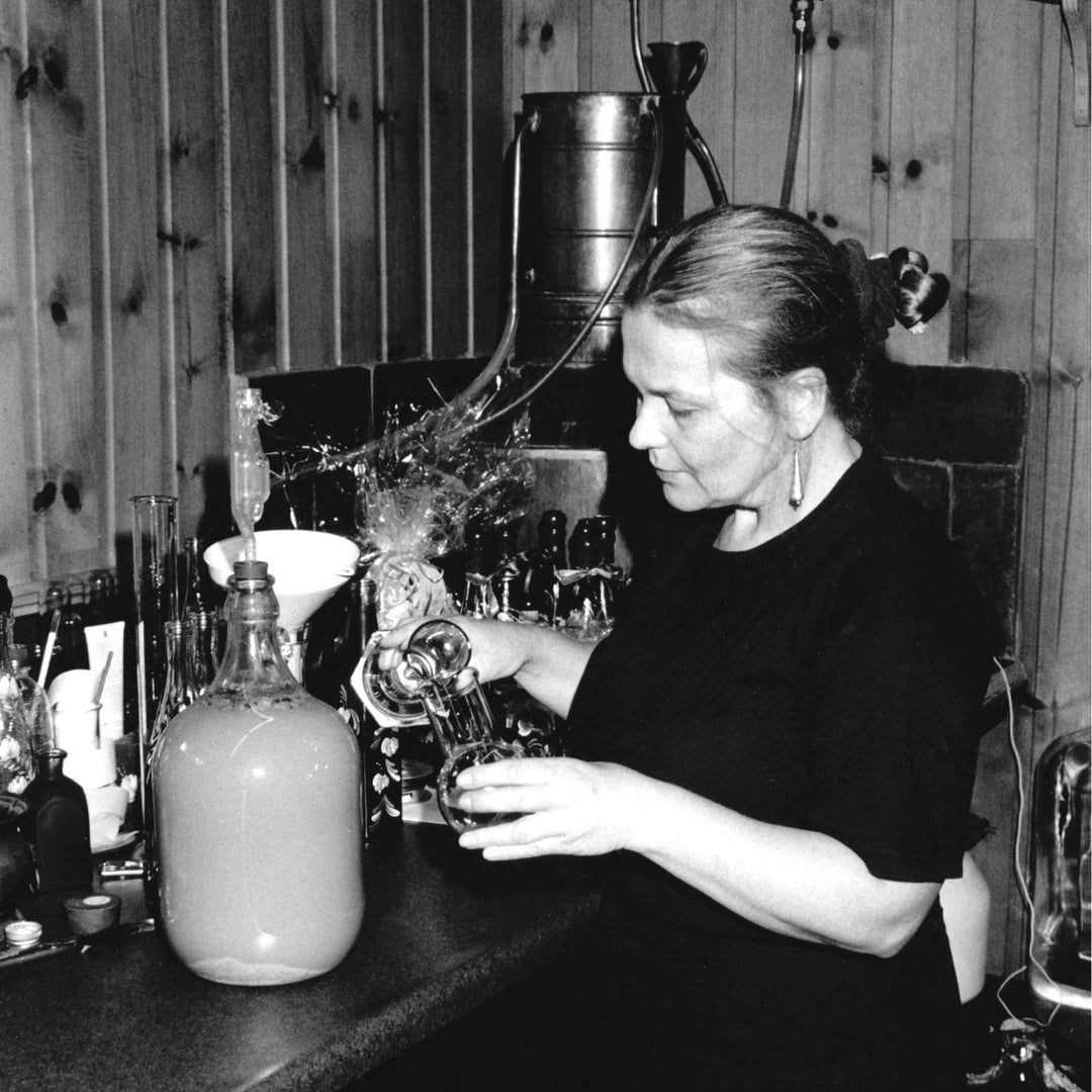 Alla Ward pouring near old still