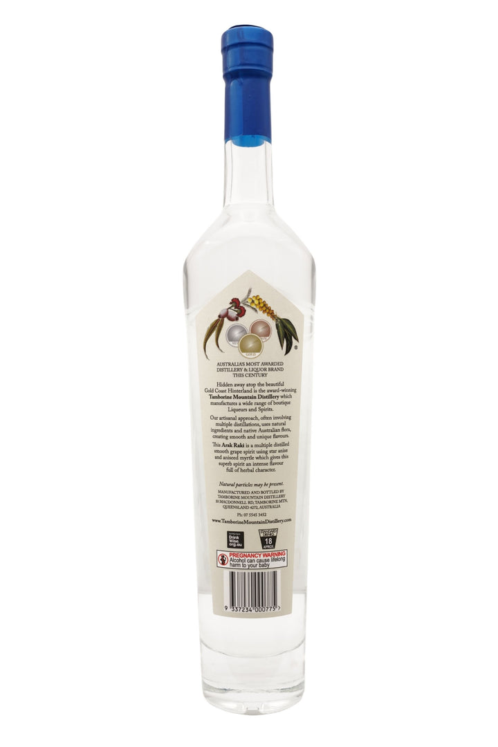 Back view of 500ml handcrafted clear glass bottle of Tamborine Mountain Distillery’s Arak Raki, featuring a label and a watercolour design