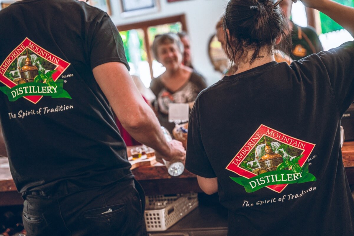 staff in uniform serving smiling happy people