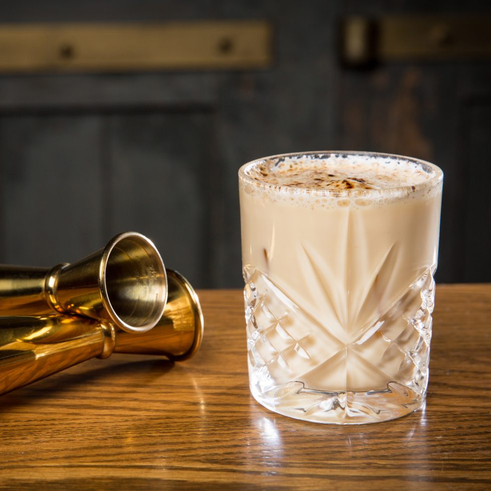 Aussie Nutter cocktail with Wattle Toffee, Dark Chocolate, Macadamia Nut and Butter Caramel liqueurs blended with vanilla ice cream, garnished with chocolate.