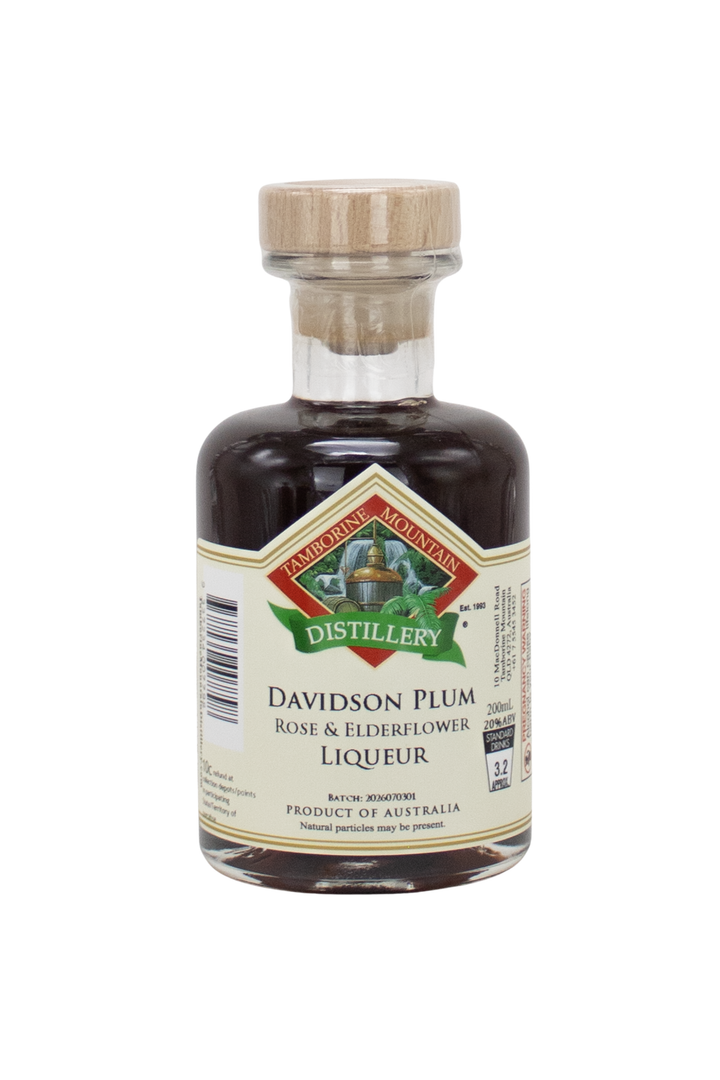200ml handcrafted bottle of Tamborine Mountain Distillery’s Davidson Plum with Rose & Elderflower Liqueur, in clear glass with small artisan label