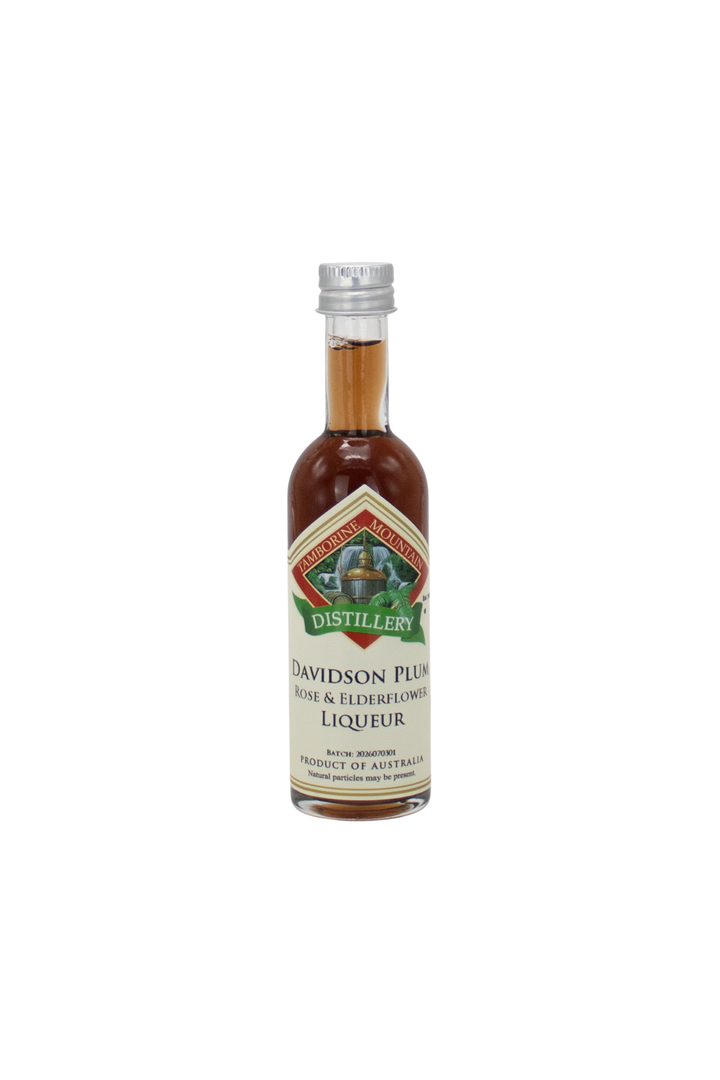 55ml handcrafted bottle of Tamborine Mountain Distillery’s Davidson Plum with Rose & Elderflower Liqueur, in clear glass with small artisan label