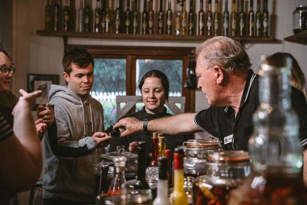 barman serving happy customers tastings
