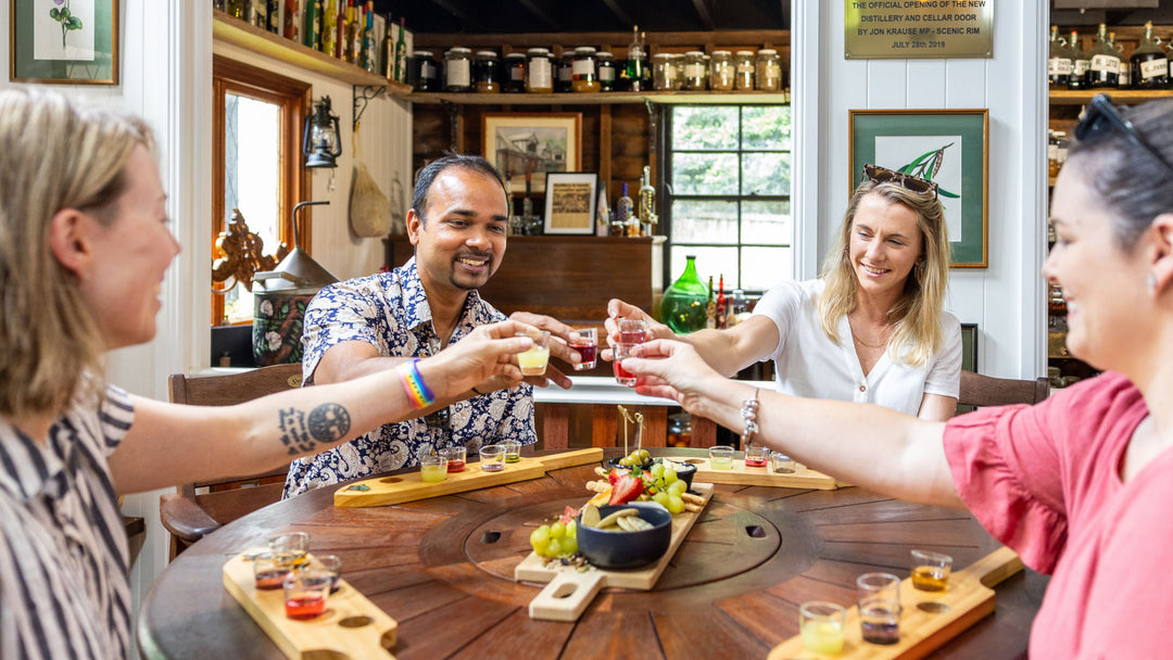Guests enjoying a spirit and liqueur tasting at Tamborine Mountain Distillery